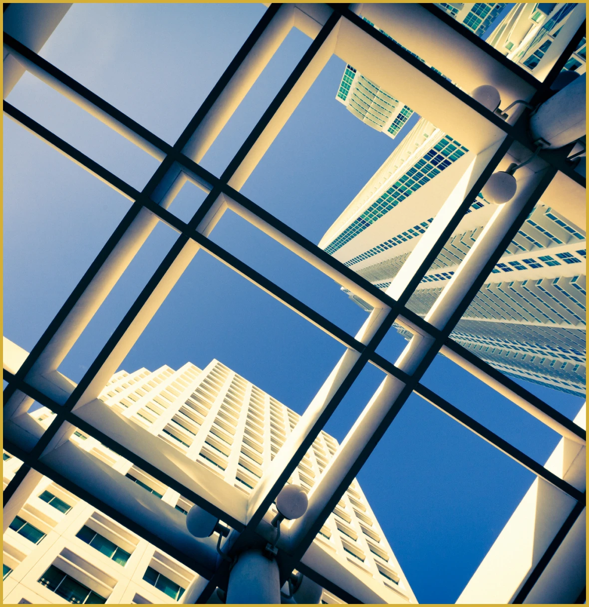 Tall buildings framed by metal grid