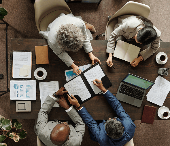 Overhead view of business meeting with documents